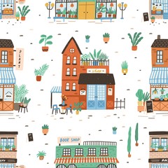 Fototapete - Seamless pattern with city buildings on white background. Backdrop with facades of bakery or bakeshop, book store, plant shop. Cute flat vector illustration for wrapping paper, textile print.