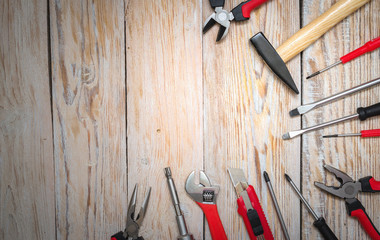 Working tools for repair on wooden background. The view from the top.