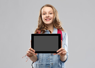 Poster - education, school and people concept - happy smiling teenage student girl with bag showing blank tablet computer screen over grey background