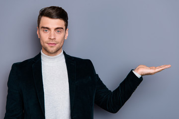 Portrait of his he nice cute handsome attractive classy chic bearded guy wearing velveteen blazer holding object on palm isolated over gray violet purple pastel background