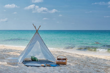 Romantic White Picnic Tent On White Sand Beach With Crystal Clear Water And Blue Sky At Background