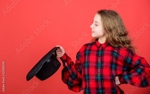 Cuadros en Lienzo Girl artistic kid practicing acting skills with black hat