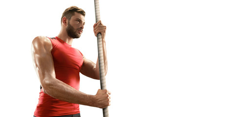 Wall Mural - Isolated Young male pole vault athlete with pole bar. Men in sport clothes on white background