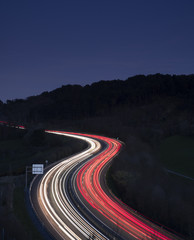 car lights on the road at night heading to the city