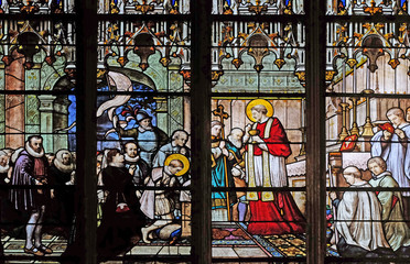 St. Aloysius Gonzaga receiving first communion from the hands of Saint Charles Borromeo, stained glass window in Saint Severin church in Paris, France 