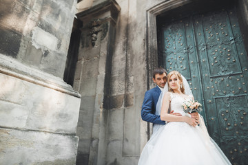 Luxury married wedding couple, bride and groom posing in old city