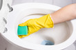 Close-up of hands  cleaning toilet