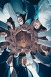 © deagreez - Vertical low angle view photo business people round circle she her he him his hold hands arms fists together celebrate project prize nomination power inspiration all dressed formal wear jackets shirts