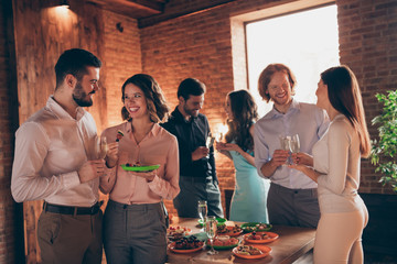 Poster - Portrait of nice attractive lovely charming pretty cheerful positive ladies gentlemen having fun house romance event family occasion luxury time buffet table snack in industrial loft interior room