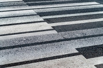 Crosswalk in the form of piano keys. Abstract musical background. Piano shaped lines. an interesting way of embellishing roads and getting people to be careful.