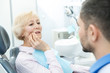 © Nestor - Senior woman suffering from toothache visiting dentist