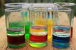  Multicomponent systems of liquids in chemical glasses, insoluble in each other liquids with different densities.
