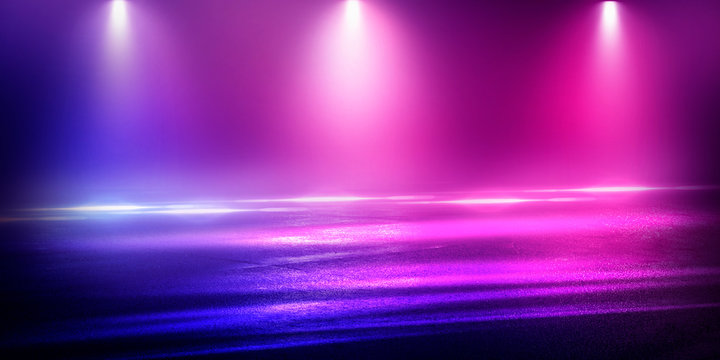 Background of the room with concrete pavement. Blue and pink neon light. Smoke, fog, wet asphalt with reflection of lights. Abstract light, searchlight rays. Night view of the street with lights, dark