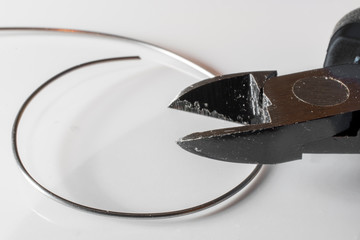 Detail of steel pliers with white background