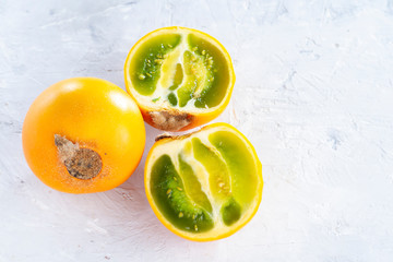 Wall Mural - lulo fruit on white background (Solanum quitoense)