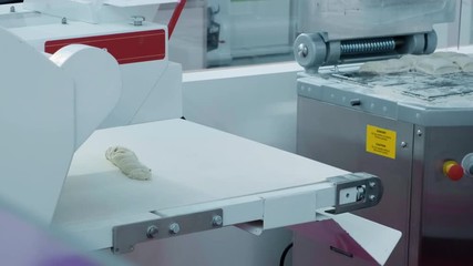 Poster - Professional confectioner cook claps his hands and powder flies, flour. Concept: the production of sweets pies pastry dough, gourmet, pure product, baking, work in restaurants, bake beautiful products