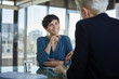 © Westend61 - Two businesswomen talking at desk in office