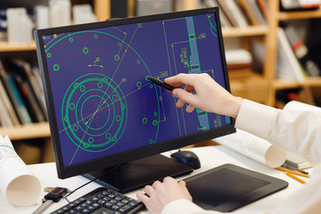 Fototapete - Engineer working on computer at the design of cad scheme.
