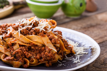 Fettuccine pasta with bolognese sauce and thyme