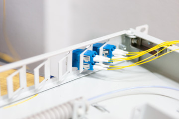 Fototapete - worker comunicate fiber optic cable at opto box. installing new network equipment