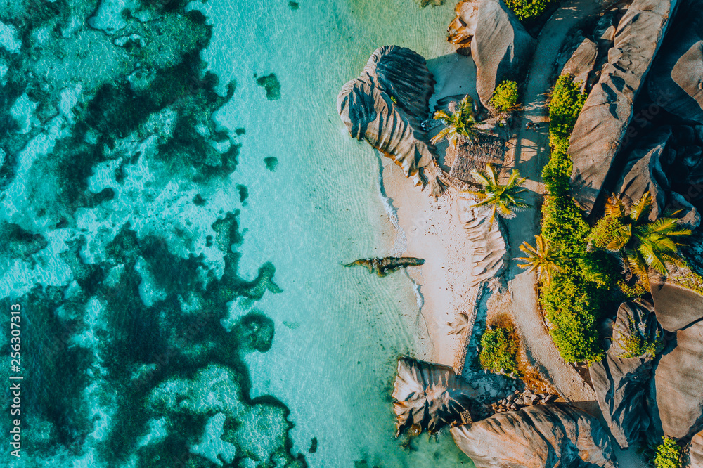 Aerial photo of famous paradiselike tropical beach Anse Source D Argent at La Digue island, Seychelles. Summer vacation, travel and lifestyle concept - obrazy, fototapety, plakaty 