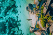 Aerial photo of famous paradiselike tropical beach Anse Source D Argent at La Digue island, Seychelles. Summer vacation, travel and lifestyle concept