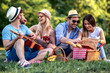 © ivanko80 - Happy young friends having picnic in the park