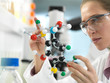 © Westend61 - Scientist examining a drug formula design using a molecular model in the laboratory