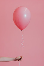 Girl With A Pink Helium Balloon