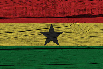 Wall Mural - ghana flag painted on old wood plank