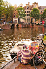 Plein Air Painter On Location By An Amsterdam Canal