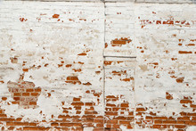 The Texture Of The Old Brick Wall Painted White With Peeling Paint