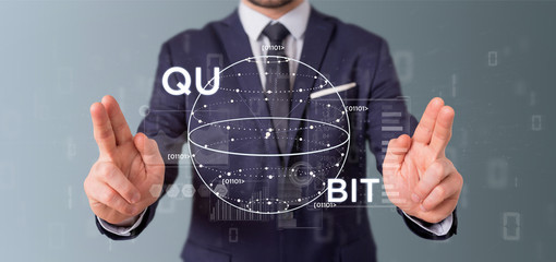 Poster - Businessman holding Quantum computing concept with qubit icon 3d rendering