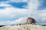 White Dome geyser of Lower Geyser Basin erupting spout of steam, Yellowstone national park, USA