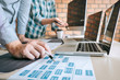 © Ngampol - Team of Developer programmer meeting and brainstorming and programming