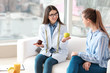 © Pixel-Shot - Young woman visiting nutritionist in weight loss clinic