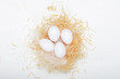 © mellisandra - Eggs in a nest of hay on a white background. Concept easter composition, spring holiday, healthy food. Top view, flat lay.
