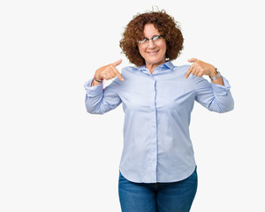 Beautiful middle ager senior businees woman wearing glasses over isolated background looking confident with smile on face, pointing oneself with fingers proud and happy.