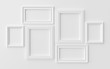 White photoframes on white wall with shadows