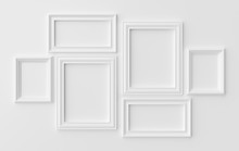 White Photoframes On White Wall With Shadows