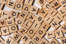 Alphabet Letters On Wooden Scrabble Pieces Scattered