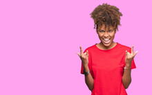Beautiful Young African American Woman Over Isolated Background Shouting With Crazy Expression Doing Rock Symbol With Hands Up. Music Star. Heavy Concept.
