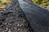 Fototapeta Sawanna - New asphalt on a pedestrian road as a background