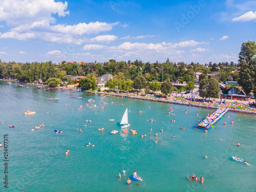 aerial view of lake with swimming people. summer time Obraz na płótnie
