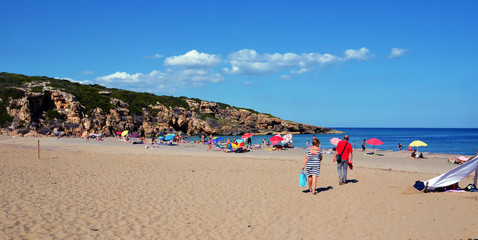 Poster - tourists on the beach (cala mosche) in one of the most beautiful beaches of Sicily, in the Vendicari Natural Reserve Siracusa Italy 