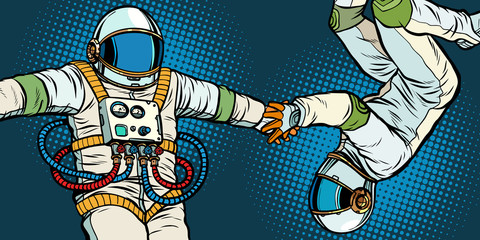 Wall Mural - a couple in love, astronauts holding hands