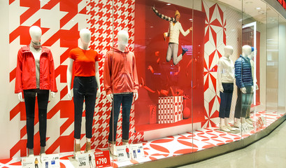 Front of Uniqlo store. Luxury and fashionable brand window display. Winter collection Welcoming the Christmas Festival.