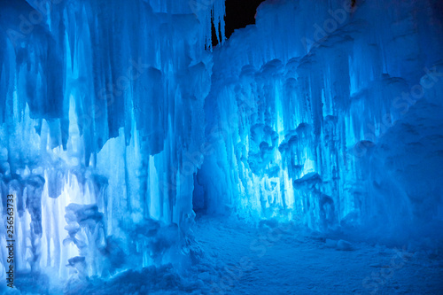 Fotomural Wall of blue icicles on a subzero night after sunset on a lake in Minnesota USA