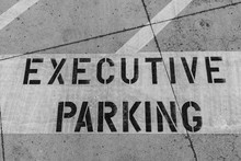 Executive Parking Sign And Diagonal Lines Written On Parking Lot Surface Warning Company Employees About Reserved Parking Space For Upper, Senior, Top Management