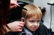 © deviddo - The little boy in the barber shop